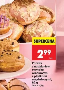 Pączek z nadzieniem o smaku wiśniowym z płatkami migdałowymi